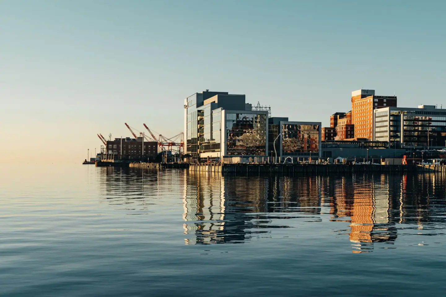 The Halifax waterfront at first light, reflected in a calm harbour