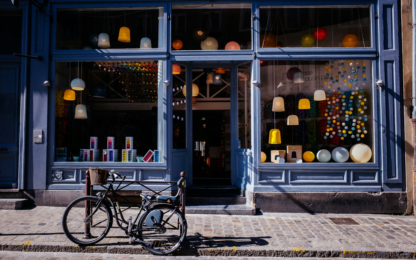 Independent retail storefront with merchandise displayed in the front windows